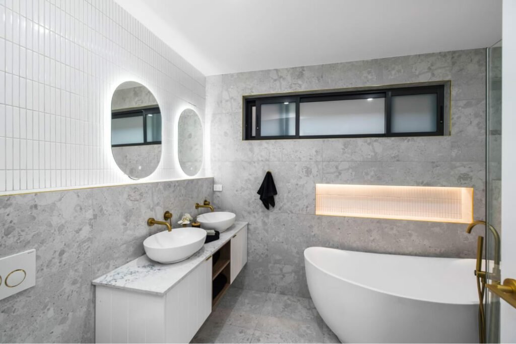 A newly remodeled bathroom featuring a sleek bathtub as the centerpiece.